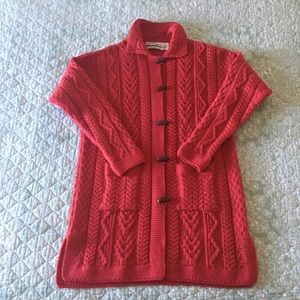 Red sweater coat by Aran Crafts